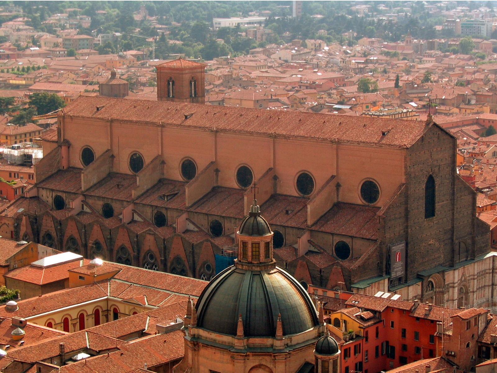 Wikipedia's Basilica of San Petronio article showing a photo of the basilica's brick exterior and unfinished facade viewed from the Asinelli tower