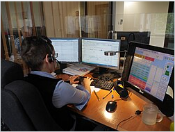 Wikipedia's 112 (emergency telephone number) article showing a photo of an operator responding to a 112 emergency call at a dispatch center in Krakow, Poland