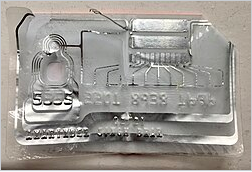 Wikipedia's Contactless payment article showing a photo of a bank card opened up to reveal its embedded RF antenna