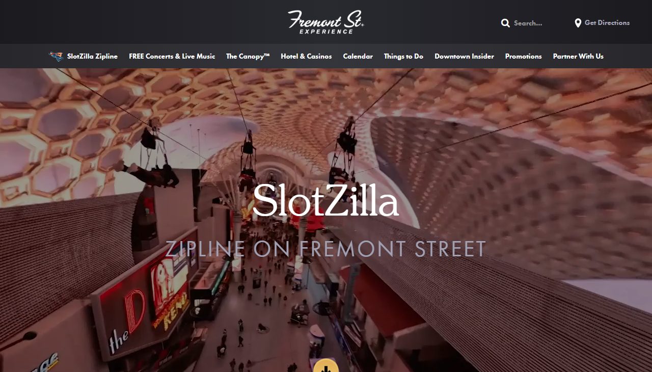 SlotZilla's own webpage, showing zip line riders flying above the crowded Fremont Street Experience pedestrian mall beneath the LED canopy