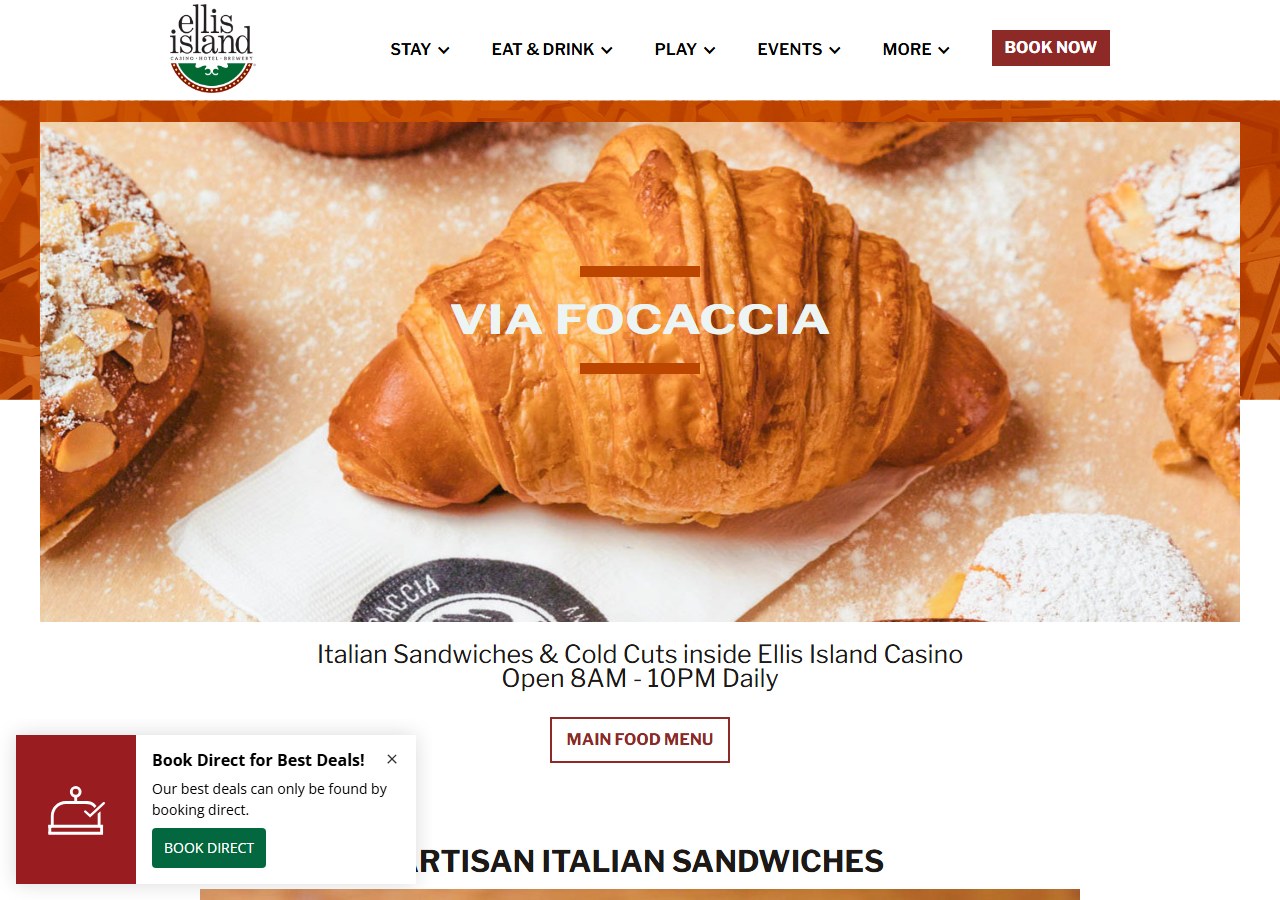 Via Focaccia's own webpage at Ellis Island Casino in Las Vegas, showing a fresh almond croissant on parchment paper beneath the restaurant's branded logo card