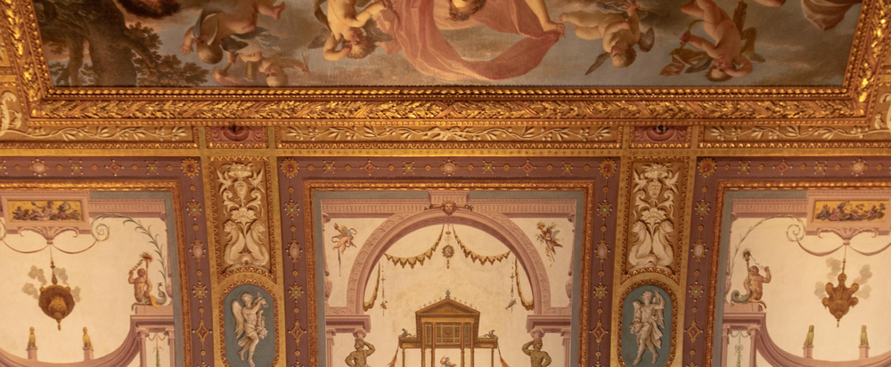 Galleria Borghese's official visiting-information page showing a photo of one of the gallery's ornate painted and gilded ceiling frescoes