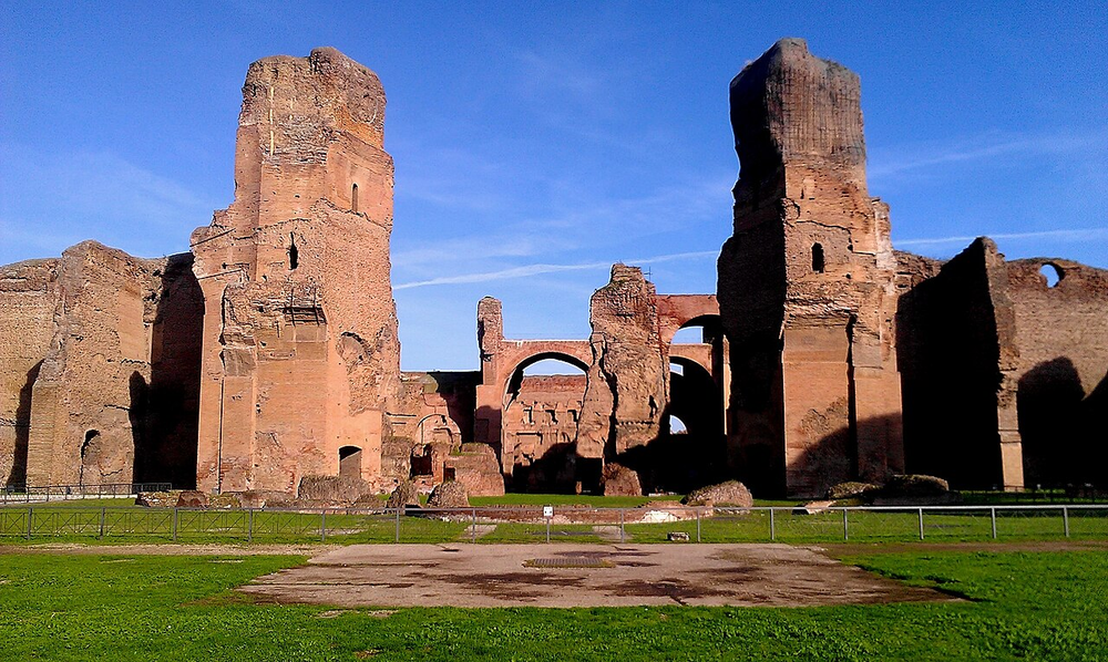 Wikipedia's Baths of Caracalla article showing a photo of the towering brick ruins of the ancient Roman bath complex, viewed from the southwest