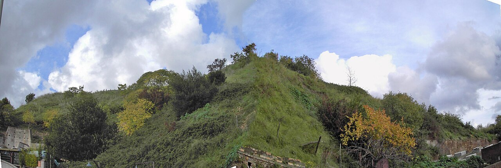Wikipedia's Monte Testaccio article showing a photo of the grassy hill, which is actually a 2,000-year-old mound of broken Roman olive oil amphorae