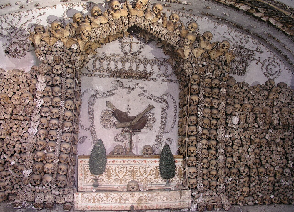 Wikipedia's Capuchin Crypt article showing photos of chapel walls and ceilings decorated entirely with the arranged skeletal remains of Capuchin friars
